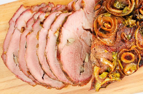 Roast pork on a wooden board — Stock Photo, Image