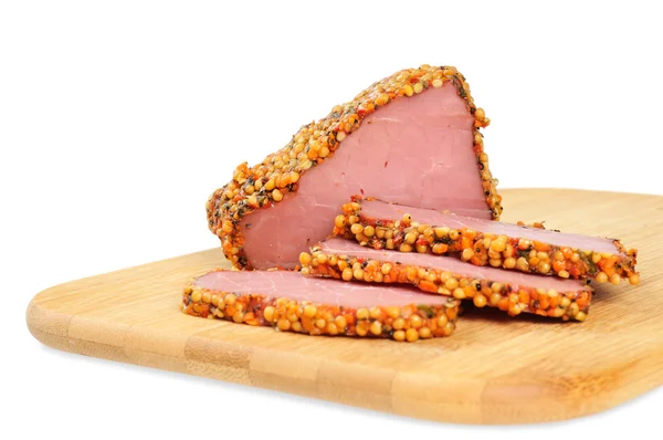 Piece of a ham with spices on a wooden board — Stock Photo, Image