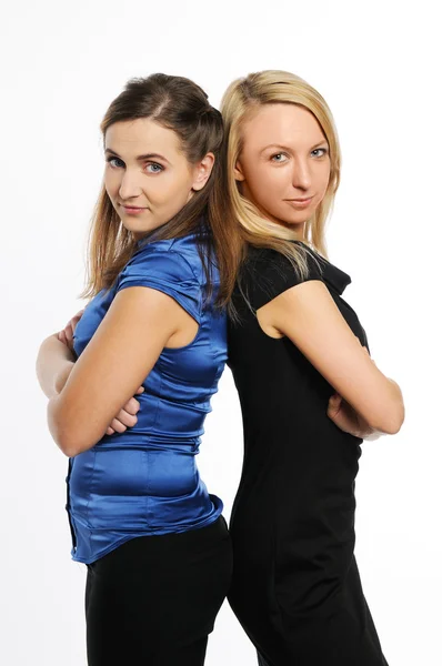 Dos jóvenes mujeres atractivas de pie Imagen De Stock