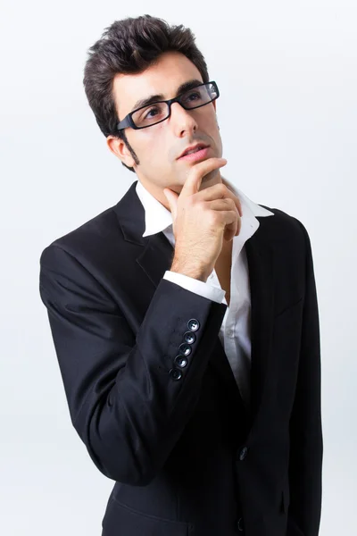 眼镜和黑色西装的表现力商人 — 图库照片