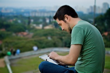 Young Man with Tablet clipart