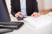 Closeup of a businesswoman doing finances