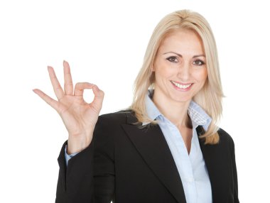 Beautilful business woman making a victory gesture clipart