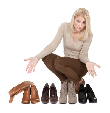 Beautiful young woomen choosing shoes to wear clipart