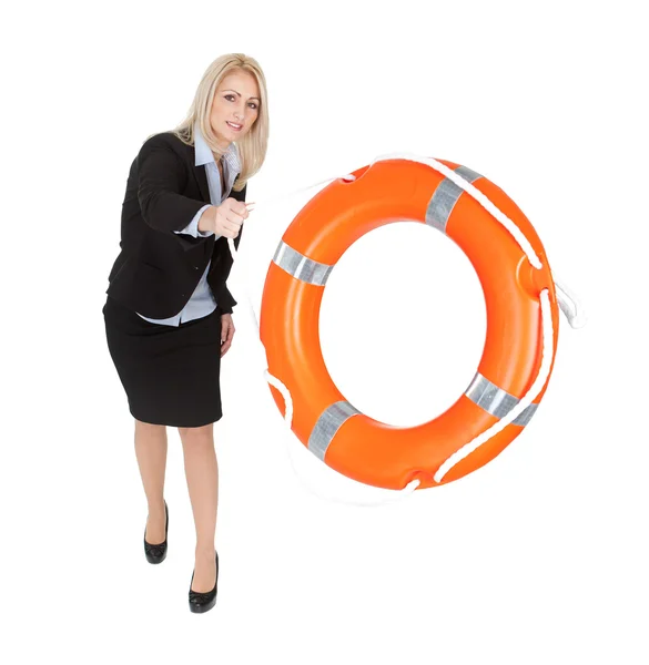 Beautiful businesswoman throwing life buoy — Stock Photo, Image