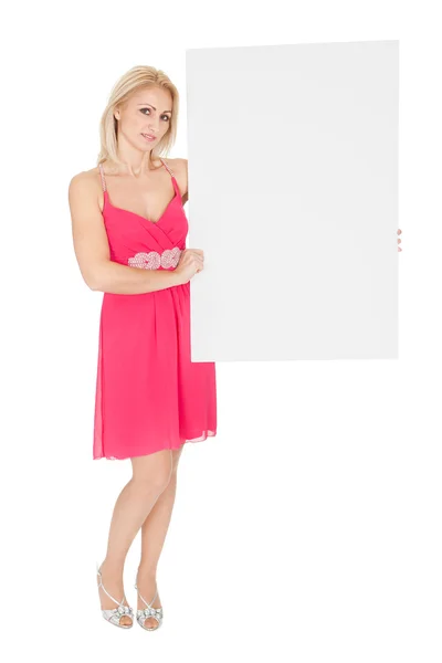 Beautiful young woman presenting an empty board — Stock Photo, Image