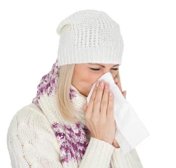 stock image Woman in warm winter clothing sneezing from cold