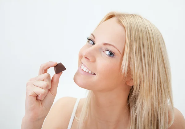stock image Beautiful woman eating chocolate