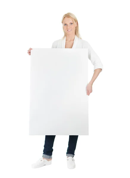 Beautiful young woman presenting empty board — Stock Photo, Image