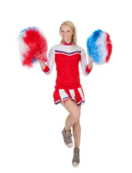 Lachende mooie cheerleader met pompoms. — Stockfoto