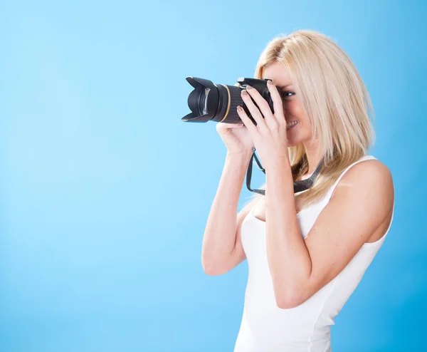 Portrait of beautiful young woman with camera — Stock Photo, Image