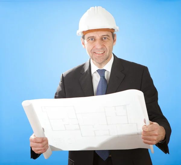 Senior architect holding blueprints on sky — Stock Photo, Image