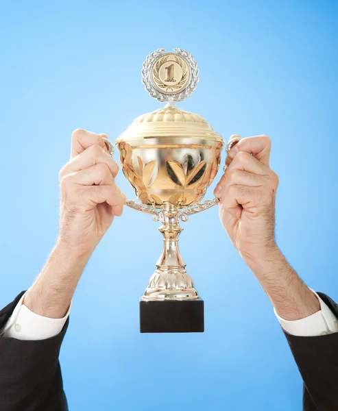 Hands holding a trophy — Stock Photo, Image