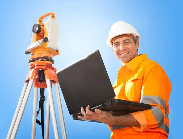 Senior land surveyor with theodolite — Stock Photo, Image