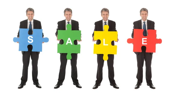 Grupa przedsiębiorstw gospodarstwa jigsaw puzzle — Zdjęcie stockowe