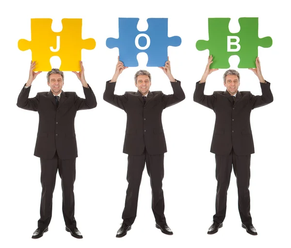 Group of business holding jigsaw puzzle — Stock Photo, Image