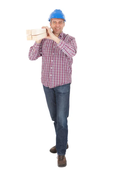 Builder carrying timber — Stock Photo, Image