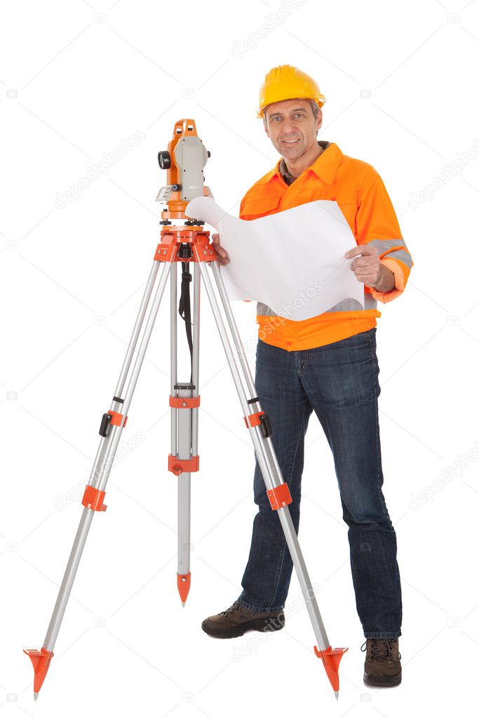 Senior land surveyor with theodolite