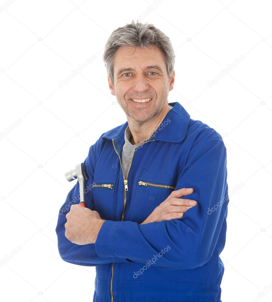 Portrait of automechanic holding a wrench