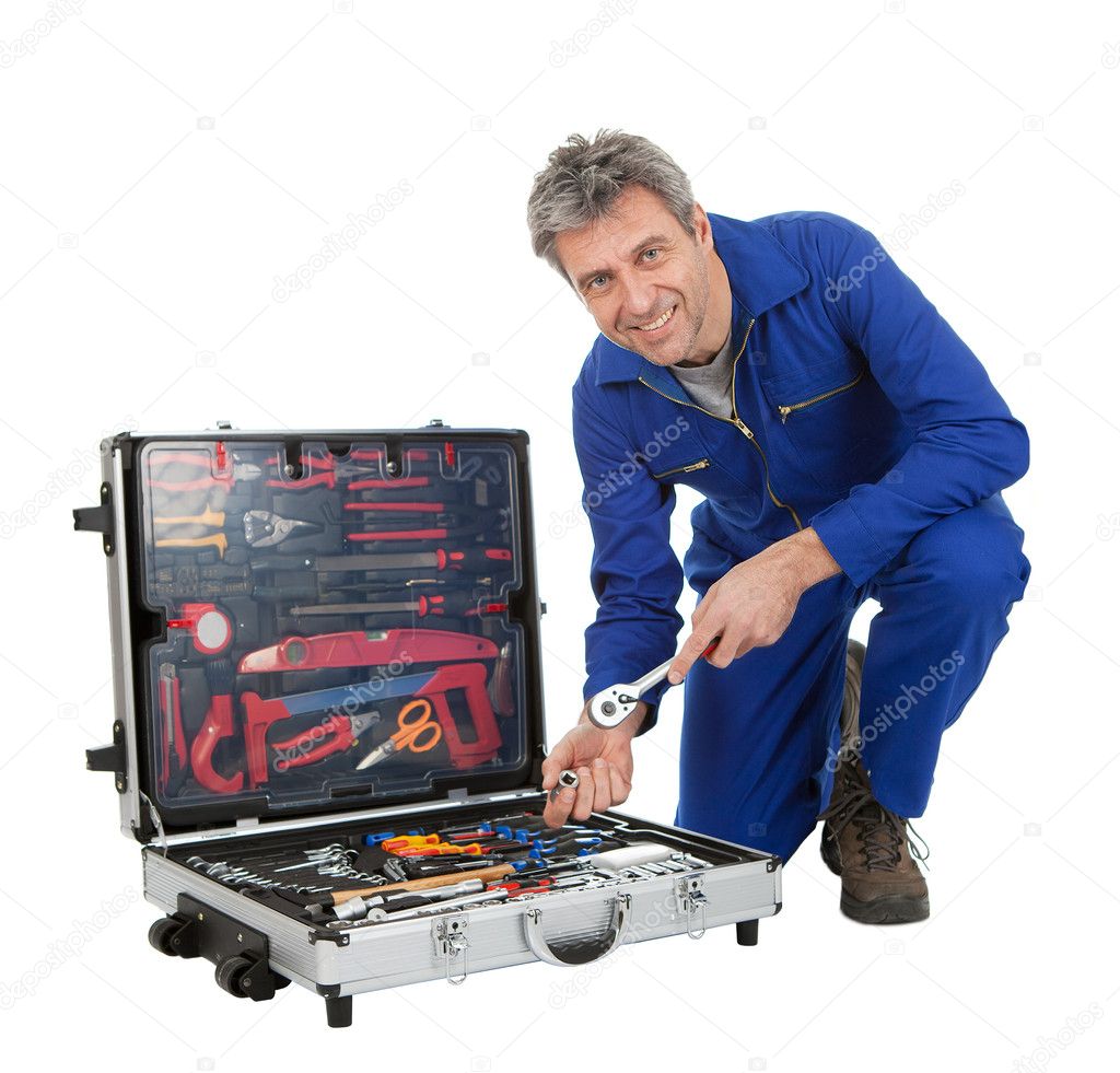 Automechanic taking a wrench out of toolbox