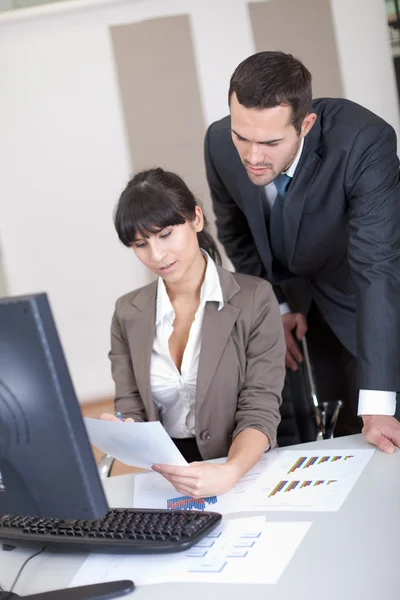Manager overseeing business woman — Stock Photo, Image