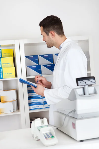 Pharmacist checking drugs — Stock Photo, Image