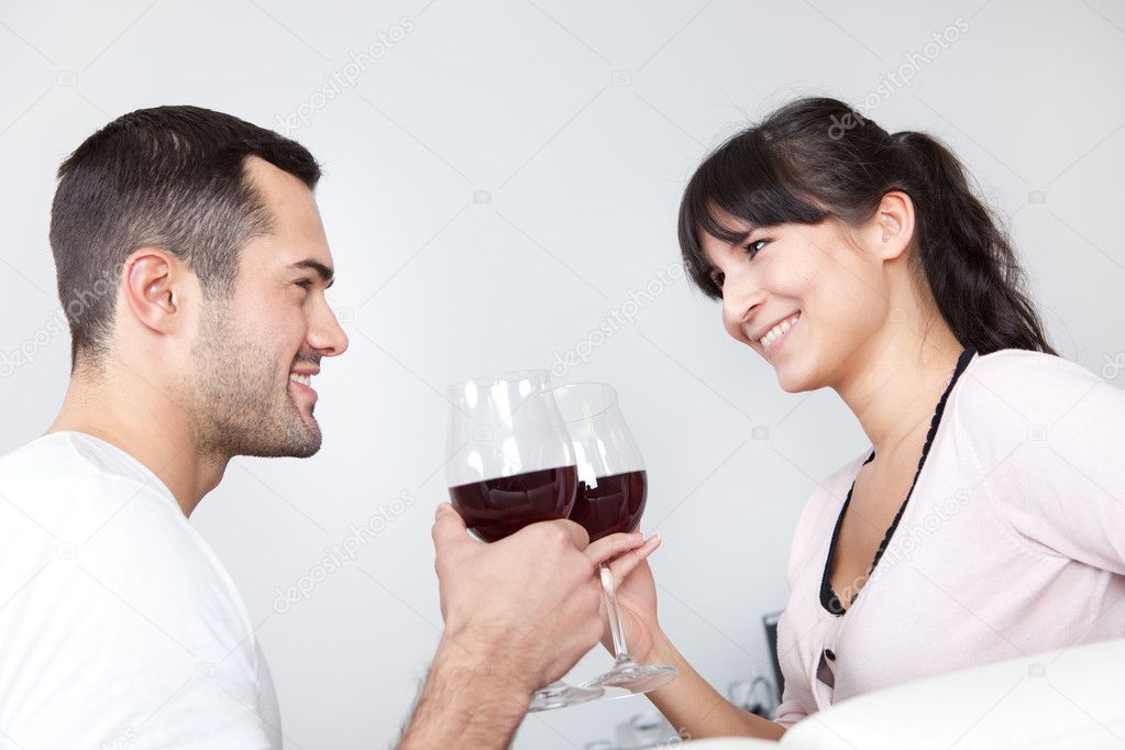 Young couple drinking red wine