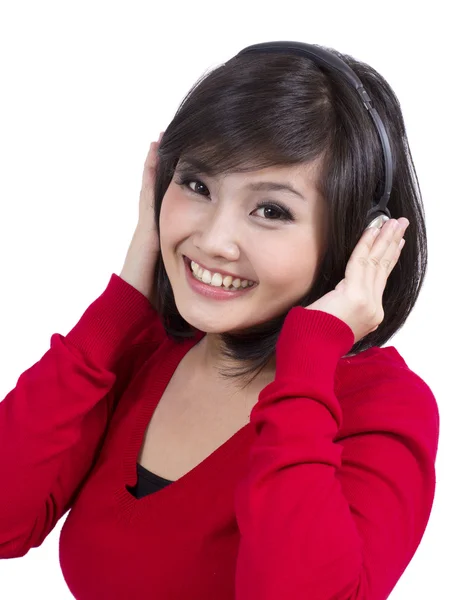 Muito jovem mulher usando fone de ouvido — Fotografia de Stock