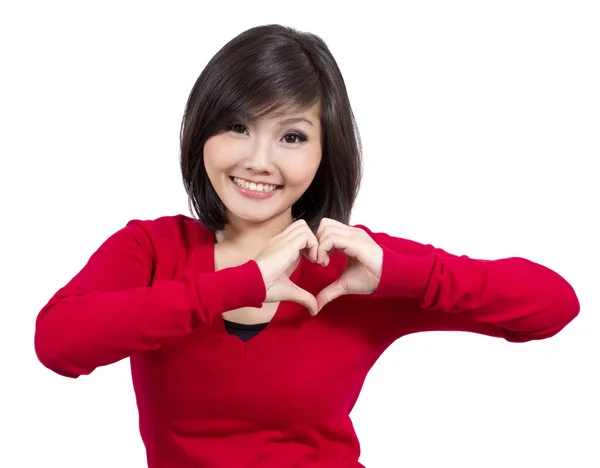 Pretty young girl making heart sign — Stock Photo, Image