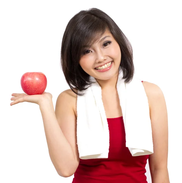 Schön asiatische Frau zeigt einen Apfel auf Ihre Hand — Stockfoto