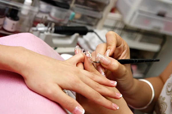 Manicure process on female hand — Stock Photo, Image