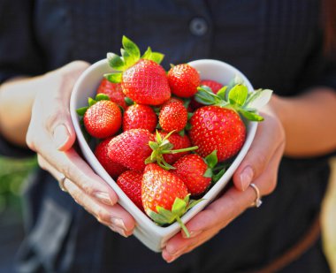Strawberry in heart shape bowl