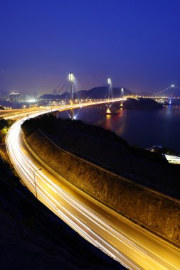 Highway and Ting Kau bridge at night clipart