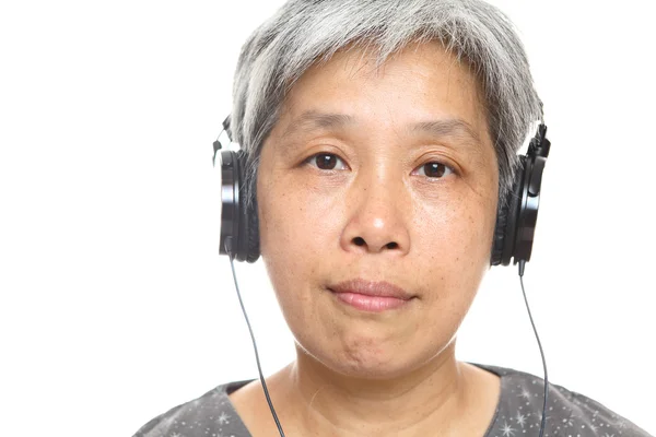 Mature woman listen music — Stock Photo, Image
