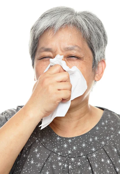 Sneezing mature woman — Stock Photo, Image