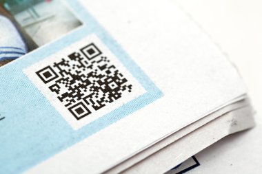 Qr code on news paper clipart