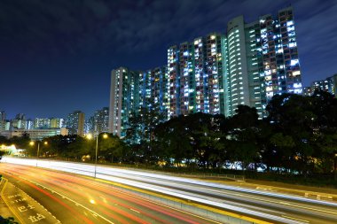 Traffic in downtown at night clipart