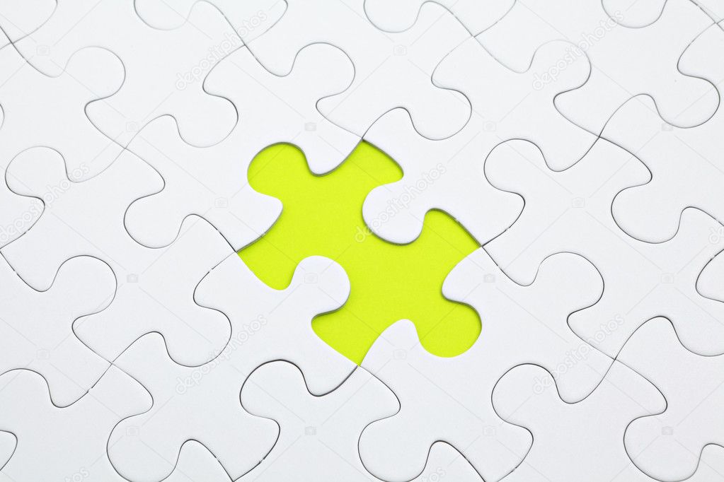 Jigsaw puzzle with green piece missed