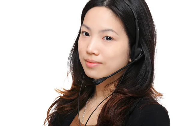 Asijské ženy sluchátky a mikrofonem — Stock fotografie