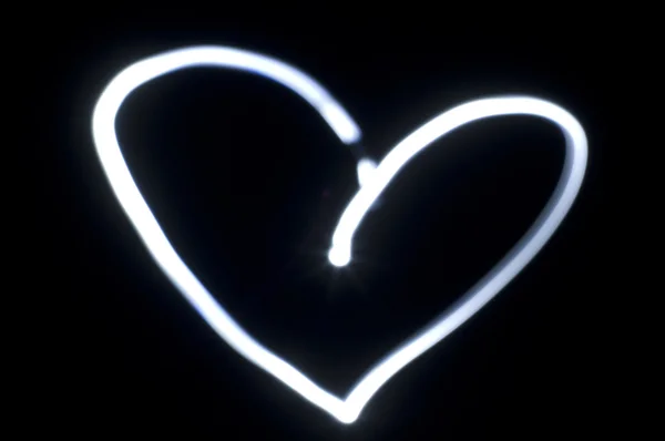 Forma do coração, pintura leve na escuridão — Fotografia de Stock