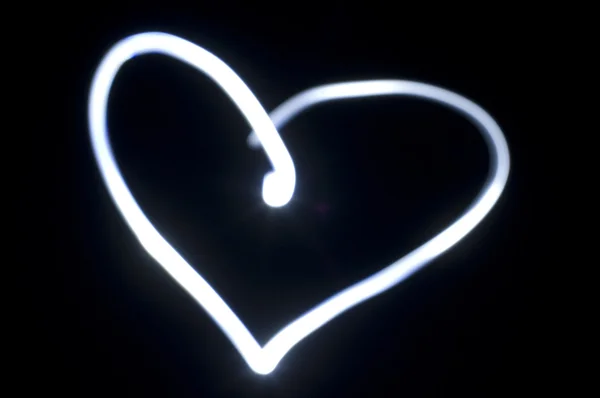 Heart shape, light painting in darkness — Stock Photo, Image