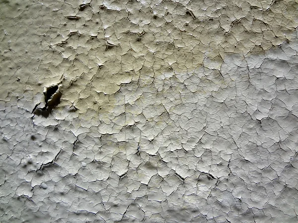 Modello di vernice bianca incrinata sulla parete — Foto Stock