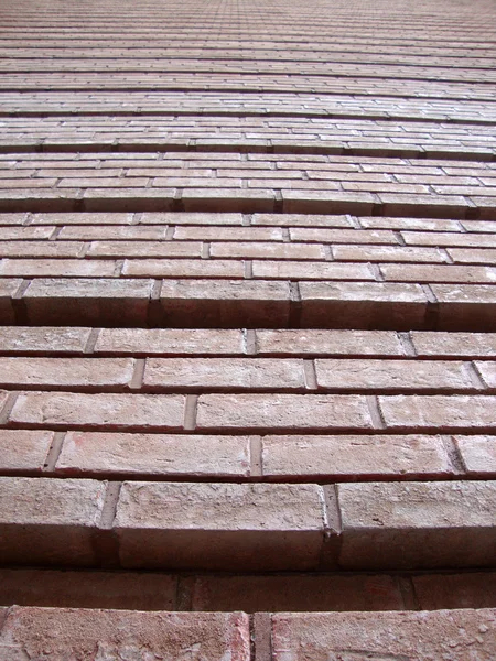 Red Brick Wall with grooves going upward — Stock Photo, Image