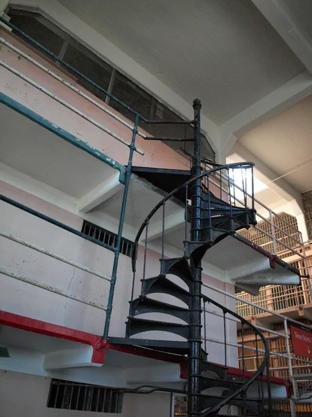 Metal spiral stairway in library of Alcatraz prison — Stock Photo, Image