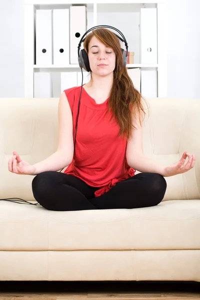 stock image Beautiful teenage girl listening to music