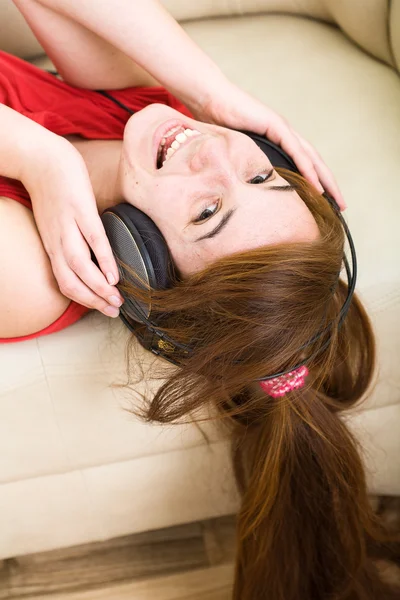 stock image Beautiful teenage girl listening to music