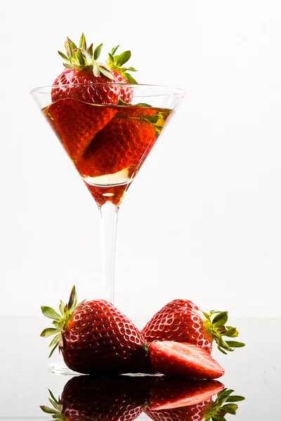Strawberry and glass Royalty Free Stock Photos