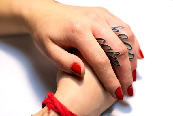 Female hands with tattoo — Stock Photo, Image