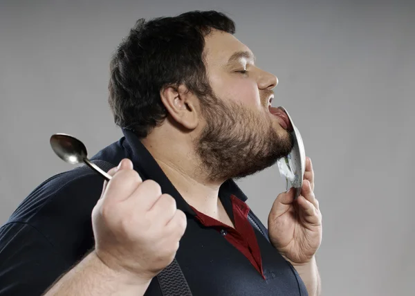 stock image Funny fat guy eating chocolate cake