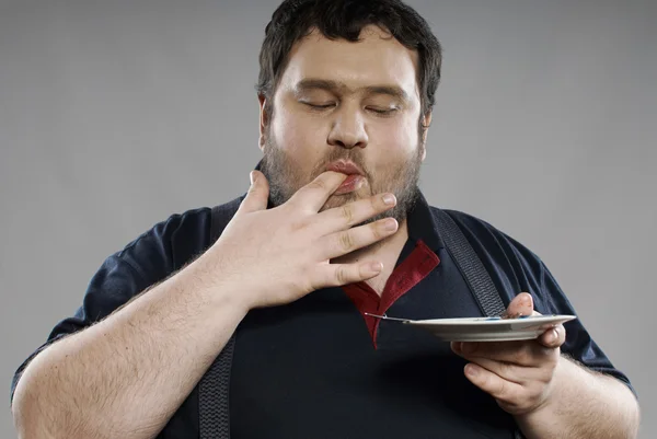 Grappige vet vent eten chocolade taart — Stockfoto